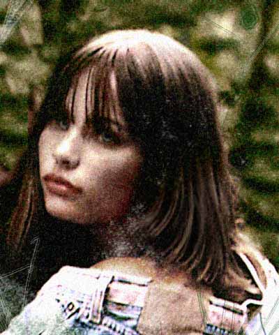 Battered old photo of a gray-eyed, dark-haired girl.