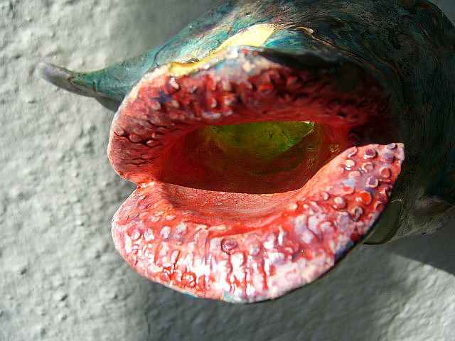 fishy sculpture with big red wet lips