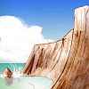 Thumbnail sketch of cliffwalled cove with girl clinging to cliff.