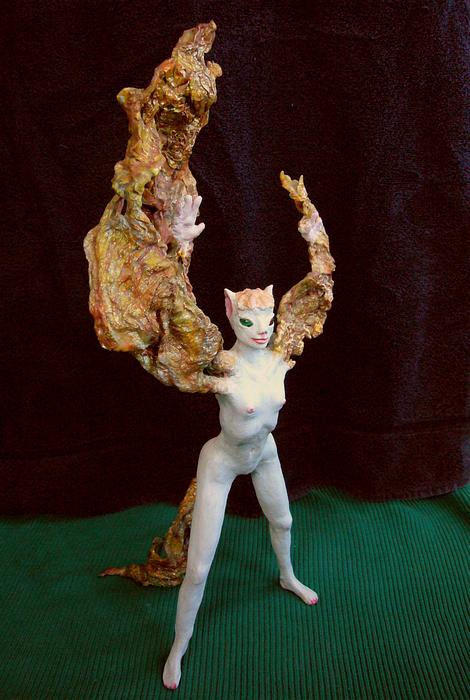 Coyote girl faces right as her arms stretch into smoky wings. Sculpture by Wayan. Click to enlarge