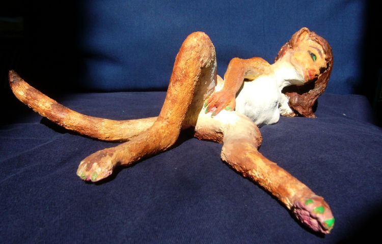 A sculpture of a catgirl happily masturbating, illustrating a dream I put off portraying (as it demanded) for ten years.