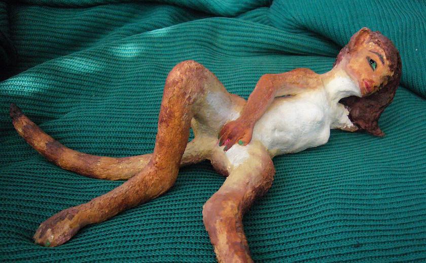 A sculpture of a catgirl happily masturbating; dream art by Wayan.