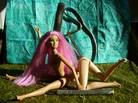 The sculpting of Fuchsia, a centauroid dancer, out of two Barbies; by Chris Wayan. Click to enlarge