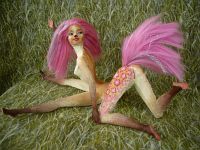 The sculpting of Fuchsia, a centauroid dancer, out of two Barbies; by Chris Wayan. Click to enlarge