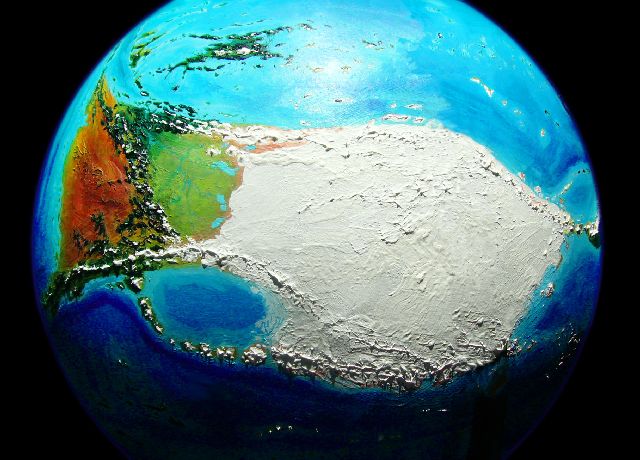 Orbital shot of two-lobed continent of Kita-Homa (Kita's arctic icecap on right, tundras and deserts of Homa on left); on Kakalea, a model of an Earthlike world full of Australias. Click to enlarge.