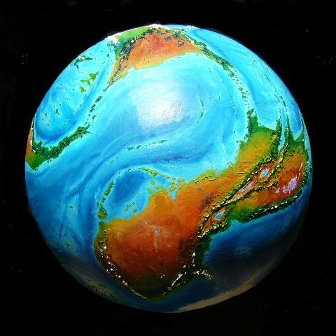 High orbital photo of Kakalea, an unlucky world. Red deserts and blue seas. Click to enlarge.