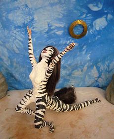 Suplica, a zebra-striped centauroid dancer. Click to enlarge