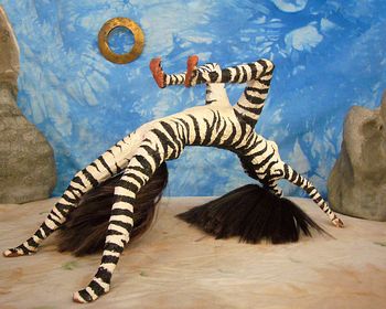 Suplica, a zebra-striped centauroid dancer. Click to enlarge