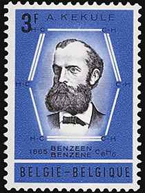 A blue Belgian stamp commemorating Kekul's discovery of benzene's structure. Kekule's bearded face, bordered by a schematic of the benzene ring.
