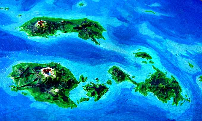 Orbital photo of the Kraoka Islands, a cluster of Hawaii-like shield volcanoes the size of Britain, at the west end of the Polesotechnic Strip, a string of small continents on Lyr, a model of a huge sea-world. Click to enlarge.