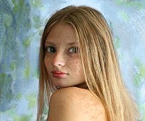 photo of a girl's face covered in freckles.