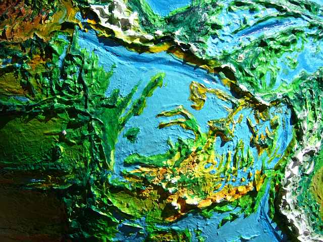 Orbital photo of the Guatemala and Panama Seas southwest of Central America, on Siphonia, an Earth with 90% of its water siphoned off. Sea level here is 3-3.5 km below Earth's; the land is savanna broken by many ridges and ranges. Click to enlarge.
