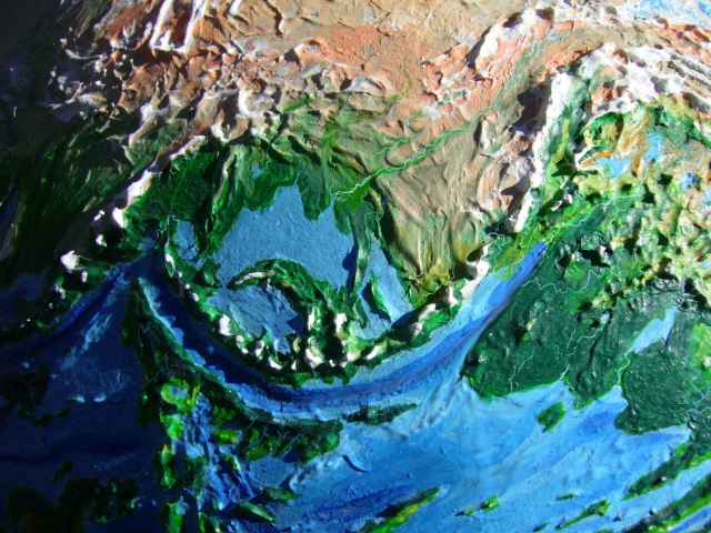 Orbital photo of the north Pacific Basin on Siphonia, an Earth with 90% of its water siphoned off. Sea level here is 4.9 km below Earth's; the Aleutian range is now the coast. Alaska is almost entirely ice and barrens. Click to enlarge.