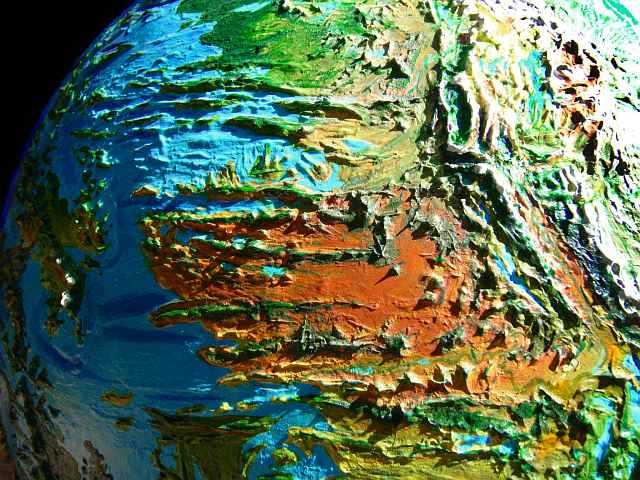 Orbital photo of the Clarion Desert east of Hawai'i on Siphonia, an Earth with 90% of its water siphoned off. Sea level here is 4.9 km below Earth's. A wide desert broken by huge east-west fracture zones with ridges and lakes. Click to enlarge.