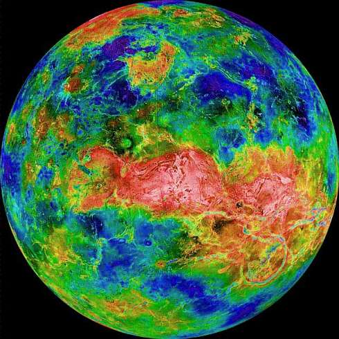 Radar scan of Venus: light is rough, dark is smooth, blue is low, red is high. Red dragonshape along equator is the highlands of Aphrodite: Thetis and Ovda.